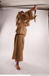 JOEL_ADAMSON WITH CRUCIFIX AND SWORD